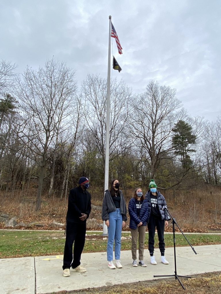 BHS students with Principal by BLM Flag on flagpole