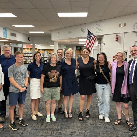 board posing with teacher