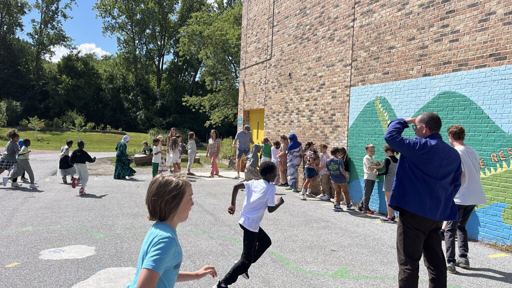 Tom at recess with students
