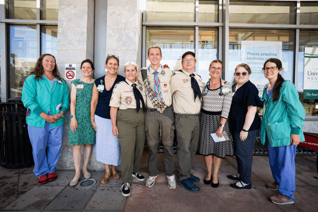 Niko posing with UVM Medical Center staff