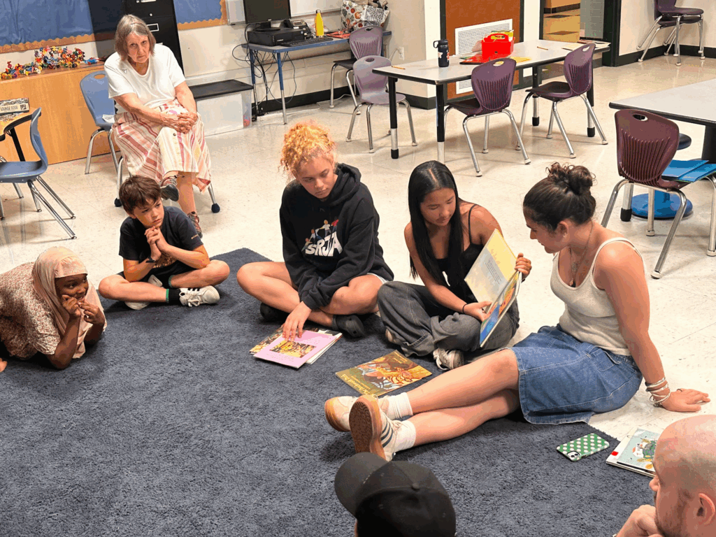 older students reading to end racism to younger students