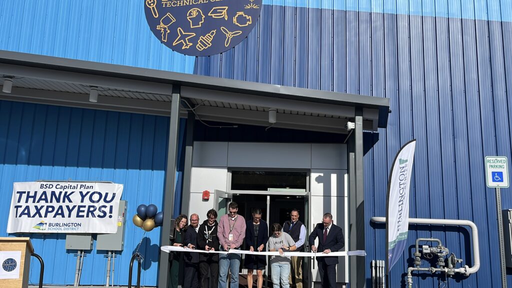 students and staff cutting ribbon