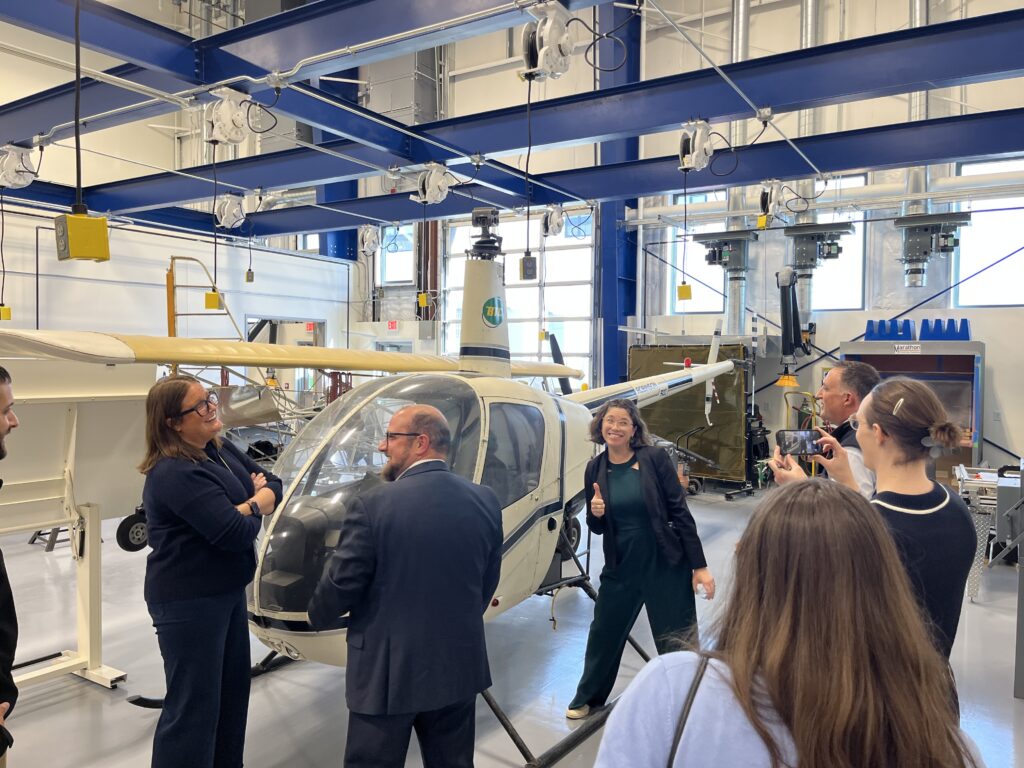 posing with a helicopter