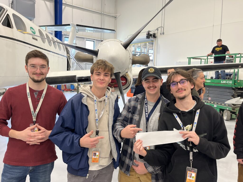 four students posing