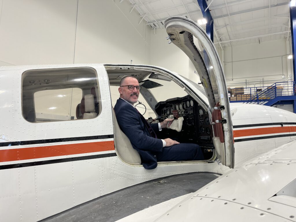 Tom Flanagan in an airplane