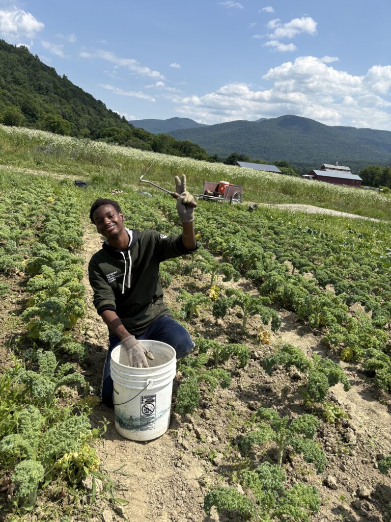 Student posing in a field